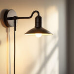 A photograph of a stylish bracket-mounted light fixture installed in a well-lit room