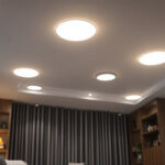 A photograph of a well-lit room featuring various styles of 6-inch led recessed lights installed in the ceiling