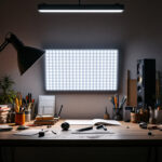 A photograph of a well-lit workspace featuring a 2x4 panel led light installation