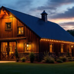 A photograph of a beautifully lit barn exterior at dusk