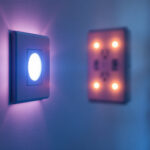 A photograph of a skilled lighting contractor installing a sleek smart lighting system in a modern home