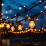 A photograph of a beautifully arranged construction light string illuminating a worksite at dusk