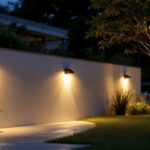 A photograph of a beautifully illuminated outdoor space featuring solar wall-mounted lights in use