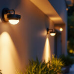 A photograph of a well-lit outdoor space featuring stylish motion detector light fixtures in action