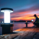 A photograph of a well-lit dock scene at dusk