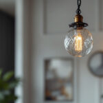 A photograph of a beautifully designed hanging lamp with an elegant chain