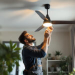 A photograph of a lighting contractor expertly installing a stylish