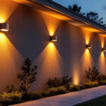 A photograph of a beautifully illuminated exterior wall of a home or building at dusk