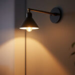 A photograph of a stylish accent wall lamp illuminating a cozy