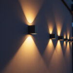 A photograph of a well-lit exterior wall showcasing modern led wall lights in a residential or commercial setting