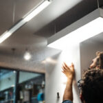 A photograph of a modern led panel light installed in a stylish interior setting