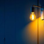 A photograph of a stylish bracket light fixture installed in a modern interior setting