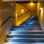 A photograph of a well-lit basement stairwell showcasing effective lighting solutions