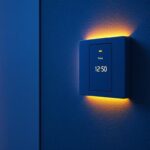A photograph of a modern electric switch with a built-in timer installed on a stylish wall