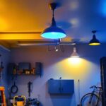 A photograph of a well-lit garage showcasing various stylish light fixtures in use
