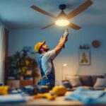 A photograph of a lighting contractor expertly installing a stylish ceiling fan in a well-lit
