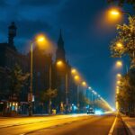 A photograph of a vibrant urban scene illuminated by high pressure sodium lamps at dusk