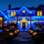 A photograph of a beautifully illuminated house showcasing vibrant blue lights
