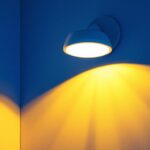 A photograph of a modern light fixture equipped with a motion sensor installed in a stylish