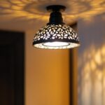 A photograph of a beautifully designed decorative pot light cover installed in a modern interior setting