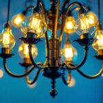 A photograph of a beautifully designed chandelier adorned with decorative light bulbs
