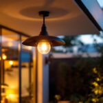 A photograph of a beautifully designed outdoor ceiling light fixture installed in an inviting outdoor setting