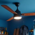 A photograph of a stylish garage ceiling fan with an integrated light fixture