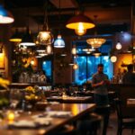 A photograph of a beautifully lit restaurant interior showcasing various lighting fixtures