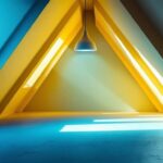 A photograph of a stylish and well-lit attic space featuring a modern light fixture
