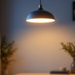A photograph of a stylish led pendant light fixture elegantly illuminated in a modern setting