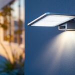 A photograph of a well-designed solar-powered lamp installed in a residential or commercial setting