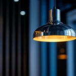 A photograph of a sleek stainless steel pendant lamp elegantly hanging in a modern interior setting