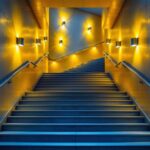 A photograph of a beautifully illuminated staircase