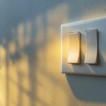 A photograph of a well-lit interior space showcasing a 3-way light switch in action