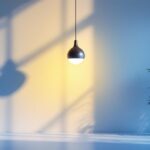 A photograph of a stylishly designed interior featuring a modern pendulum light fixture as the focal point