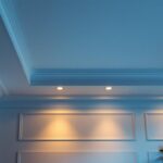 A photograph of a well-designed recessed lighting installation in a stylish interior setting