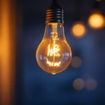 A photograph of a close-up of a flickering lightbulb in a cozy