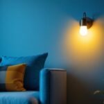A photograph of a beautifully designed simple wall sconce illuminated in a cozy