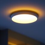 A photograph of a sleek surface mount recessed light installed in a modern interior setting