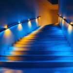 A photograph of a beautifully designed indoor staircase illuminated by stylish stairway lights