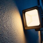 A photograph of a modern floodlight illuminating an outdoor space