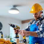 A photograph of a skilled lighting contractor in action