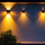 A photograph of a beautifully illuminated exterior wall featuring stylish photocell-activated lights in a residential or commercial setting