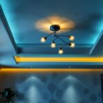 A photograph of a beautifully designed living room ceiling featuring a stylish and modern light fixture