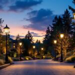 A photograph of a beautifully illuminated driveway featuring elegant light poles