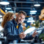 A photograph of a lighting contractor examining a variety of led lights in a well-lit showroom