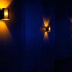 A photograph of a well-lit cinema wall featuring stylish sconces that highlight the ambiance of the space