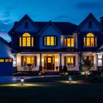 A photograph of a beautifully illuminated house at dusk