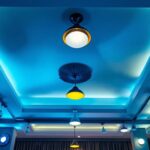 A photograph of a beautifully designed ceiling featuring a variety of lighting fixtures