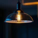 A photograph of a stylish modern pendant light fixture in a contemporary setting